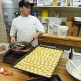 Joey tempers chocolate to drizzle on some holiday cookies.