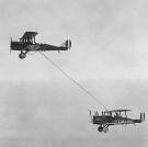 An image of the first aerial refueling performed by Captain Lowell H. Smith and Lt. John P. Richter on June 27, 1923. The DH-4B biplane remained in the air for 37 hours over San Diego, California.