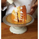 Use white buttercream to seal the turkey structure and to cover any gaps. This creates a smooth working surface for you.
