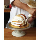 Continue to pipe white buttercream where there are gaps in the cake.