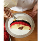 Then, add a ring of white. Be sure to overlap slightly as you pipe in a ruffled pattern.
