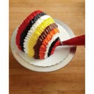 Cover every bare inch of cake with a colored ring. Be sure to end in the front with a white ring of buttercream.