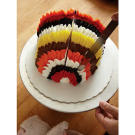 Now, it's time to feather your frosting. Using a cake icing spatula, pull the edge of it through the frosting at 1-inch intervals, starting at the back center-top of the cake and pulling all the way forward to the narrow, lower front.