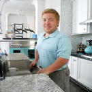 Bill's very proud of his new kitchen... he can stand at the sink without a footstool!