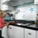 Jen gets ready to make some hot water on a stovetop that she can reach!
