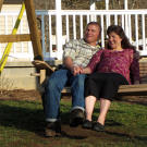 Gil and Kelly share a quiet moment alone on a swing.