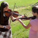 Tori and Katie play the violin.