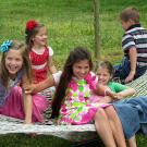 The Bates kids enjoy a hammock at their grandparents’ house.