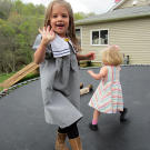 Addallee and Callie Bates play on a trampoline.