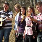 Lawson, Erin, Tori, Alyssa and Zach play guitar and sing.