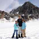 Kate, Cara and Mady stand on a glacier during their trip to Alaska