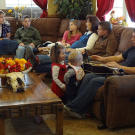 The family prepares for its morning meeting.