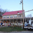 Gil in the cherry picker, putting up decorations.