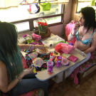 Mellie's friend creates totally unique costumes for the strip club.