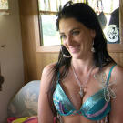 Mellie is all smiles as she enjoys the benefits of some extra padding in a blinged-out bra.