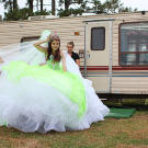Courtney keeps her giant crown in place as she leaves her house.