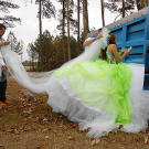Courtney does her best to get inside the truck without upsetting her giant dress or long train.