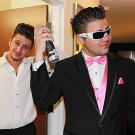 Pete and his groomsman make sure their hair is perfect before the wedding.