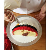 Then, add a ring of white. Be sure to overlap slightly as you pipe in a ruffled pattern.