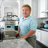 Bill's very proud of his new kitchen... he can stand at the sink without a footstool!