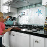 Jen gets ready to make some hot water on a stovetop that she can reach!