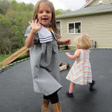 Addallee and Callie Bates play on a trampoline.