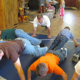 The Bates boys do push-ups as part of their wrestling lesson.