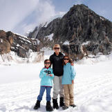 Kate, Cara and Mady stand on a glacier during their trip to Alaska