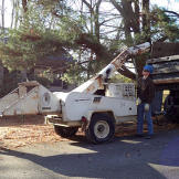 The Bates boys prepare the wood chipper.