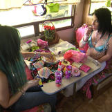 Mellie's friend creates totally unique costumes for the strip club.