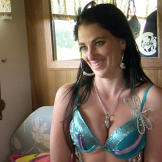 Mellie is all smiles as she enjoys the benefits of some extra padding in a blinged-out bra.