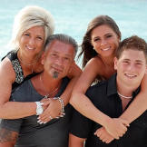 The Caputos on the beach (clockwise from front left: Larry, Teresa, Victoria Lawrence)