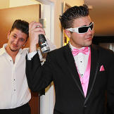 Pete and his groomsman make sure their hair is perfect before the wedding.