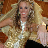 Kayla shows off her ring and a gold manicure.