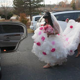 Louann gathers her full, floral skirt with a little help.