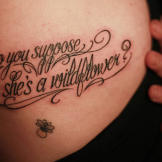"Do you suppose she's a wildflower" is a quote from Alice in Wonderland, tattoo by Megan Massacre,