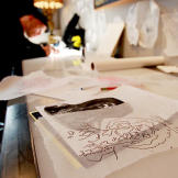 Ami James busy at work on sketches and rough drafts.