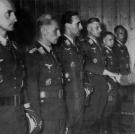 A group of German air aces including all-time highest kill count (352) pilot Erich Hartmann (2nd from left) receiving the Oak Leaves with Swords from Adolph Hitler.