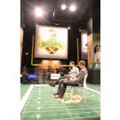 Lil Bub and her dude, Mike Bridavsky, answer questions at The Puppy Bowl Experience in Times Square.