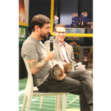 Lil Bub and her dude, Mike Bridavsky, answer questions at The Puppy Bowl Experience in Times Square.