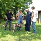 Tickle, Tim, and JT shoot the breeze with and a dump truck operator.