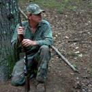 Mark strikes a watchful pose in the woods.