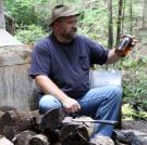 Jeff takes a moment to sit down next to his still.