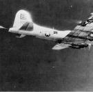 This plane was lost over Merseburg, Germany in November 1944. Despite its damage, as seen by the fire starting to break out over her right wing the tail gunner is doing everything he can to take some German fighters down with him.