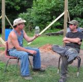 Tim shows off a jar of moonshiner to Tickle.