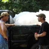 What are Tim and Tickle doing with a truckful of plastic jugs?
