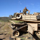 A tank being "short tracked" in 2005. This is usually only done when the tracks and/or wheels have been damaged and no recovery vehicle is nearby. This allows a vehicle with partial running gear to move under its own power.
Watch video of the