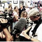 Jim Goodwin, 19 Kids and Counting sound man signing autographs. He's famous now too!