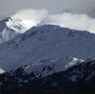 Snow coming off the mountain top.