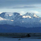 The heat of the day subsides and night moves in across the head of the bay.